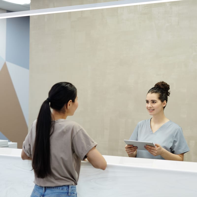 Patient checking in at the front desk at Douglas Kosek DDS in South Bend, Indiana